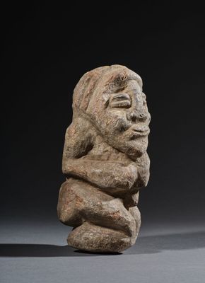 an image of a stone statue of a man with a beard