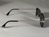 pair of black and silver sunglasses on a white surface