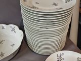 a lot of plates that are sitting on a table