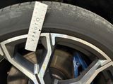 a close up of a tire with a measuring tape on it
