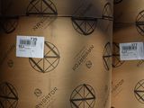 many rolls of brown paper that are stacked on top of each other