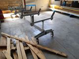 many pieces of wood on the floor in the garage