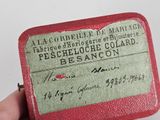 a small red box with a green label on it