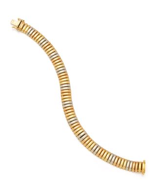 a close up of a gold bracelet on a white background