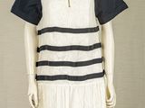 an image of a mannequin wearing a white and black dress
