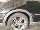 a close up of a car with a tire on it