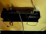 a television that is connected to a wall with wires