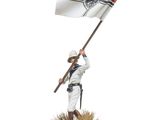 statue of a man holding a flag on a wooden base