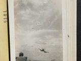 an old photo of a plane flying in the sky