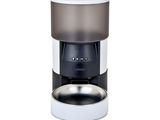 an image of a coffee grinder with a cup on top of it