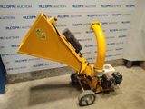 a close up of a small yellow machine on a concrete floor