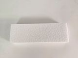 a close up of a piece of white paper on a white surface