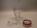 a glass vase and a glass bowl on a table