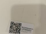 a sticker with a qr code on it sitting on a table
