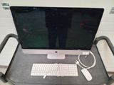 a desk with a keyboard, mouse, and monitor on it