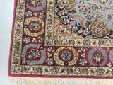 an image of a red and blue rug on a white floor