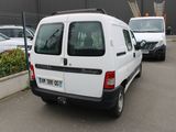 a white van that is parked in a parking lot
