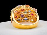an image of a gold ring with multi colored stones on it