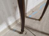 a close up of the legs of a table in a room