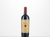 a bottle of red wine sitting on top of a table