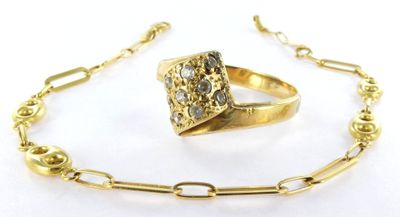 a close up of a ring on a chain with a chain around it