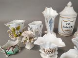 a lot of vases that are sitting on a table