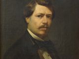 portrait of a man in a black suit and bow tie