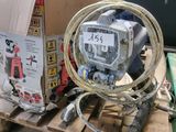a box and a hose on a pallet with a box in the background