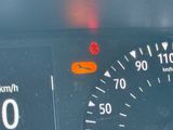 a close up of a speedometer on a car ' s dashboard