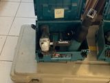 a tool box with tools inside of it on the floor