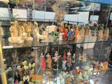 many figurines on display in a glass case