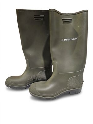 pair of green rubber boots on a white background