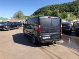 a black van that is parked in a parking lot