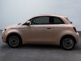 a pink car that is parked in a parking lot