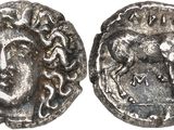 a silver coin with an image of a man on it