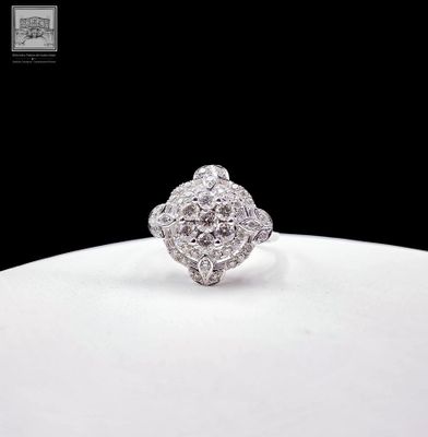 an image of a diamond ring on a white plate