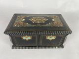 a black box with gold and blue decorations on it