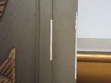 a close up of a door with a bird on it