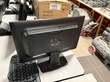 a computer monitor and keyboard on a desk in a store