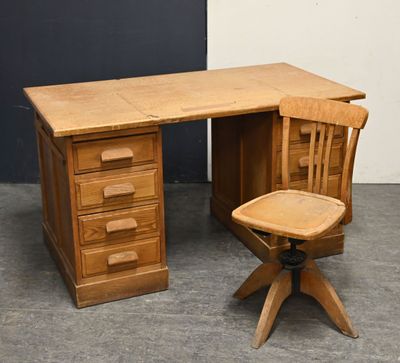 a wooden desk with a wooden chair next to it