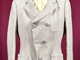 an image of a woman ' s jacket on a mannequin stand