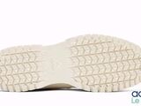 a close up of a pair of shoes on a white surface