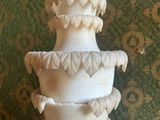 a three tiered cake sitting on top of a table
