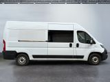 a picture of a white van parked in a garage