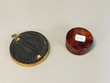a small wooden box sitting next to a small wooden box