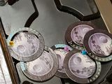 four plates on the burner of a stove top