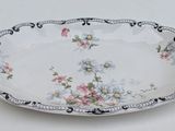 a white plate with flowers on it on a table