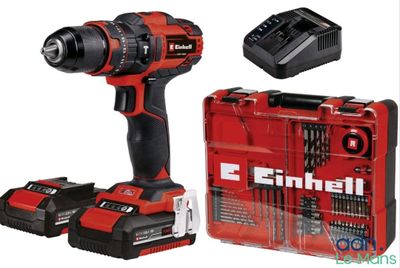 une perceuse sans fil et deux batteries dans un étui