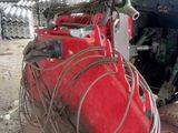 a tractor that is sitting in the dirt