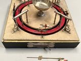 a silver plate with a red rim on it
